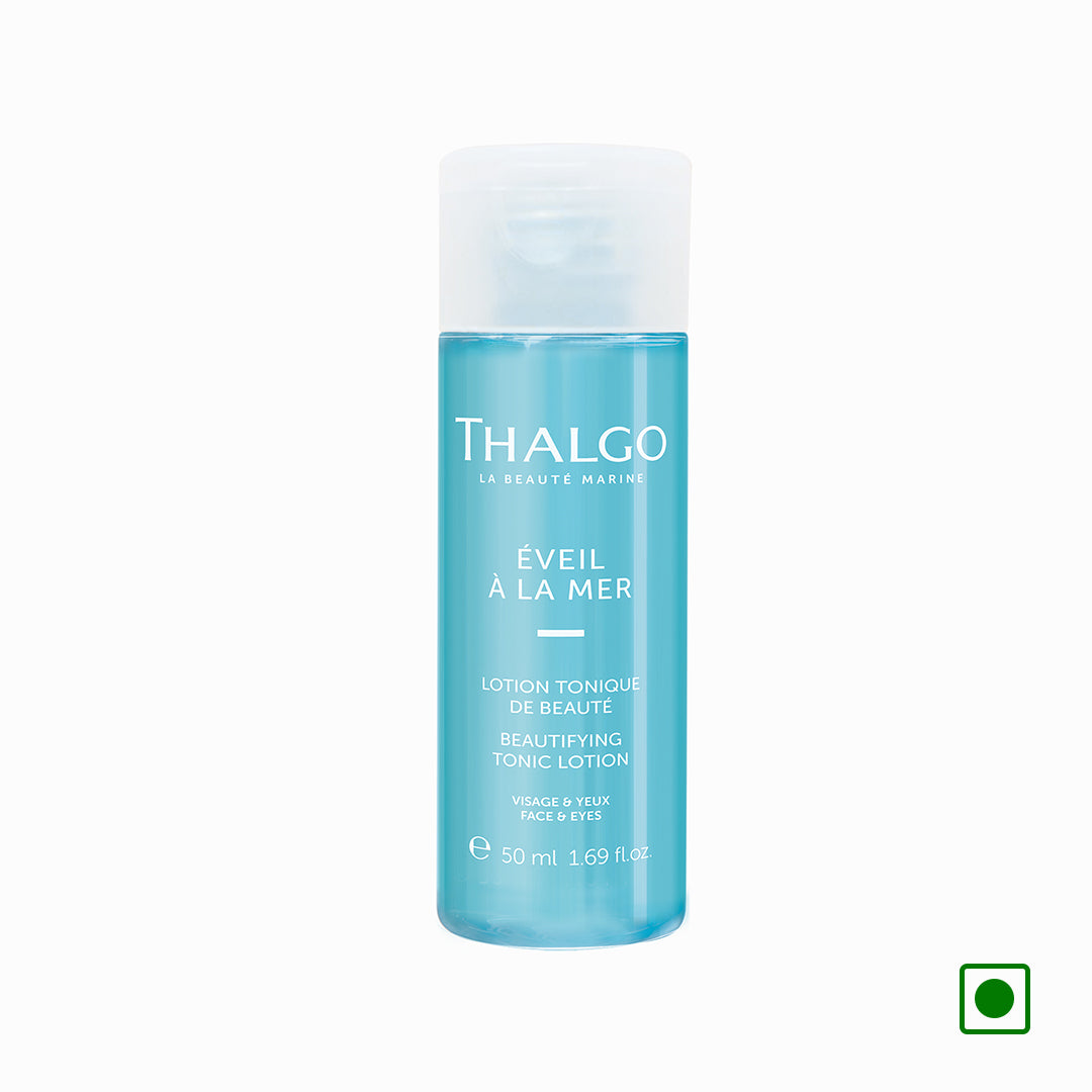 Thalgo beautifying tonic lotion bottle with white cap, 50 ml, blue liquid