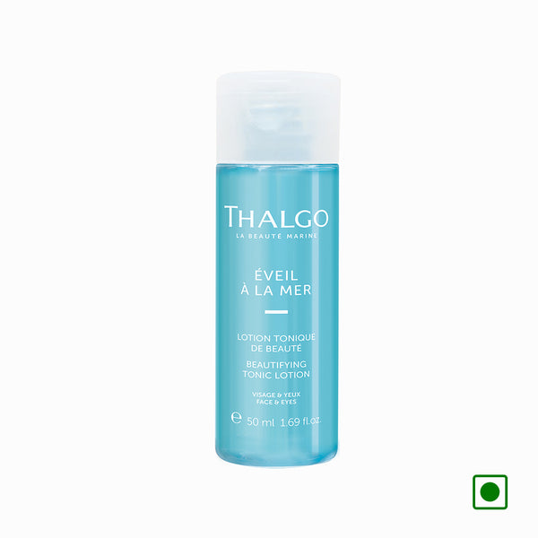 Thalgo beautifying tonic lotion bottle with white cap, 50 ml, blue liquid